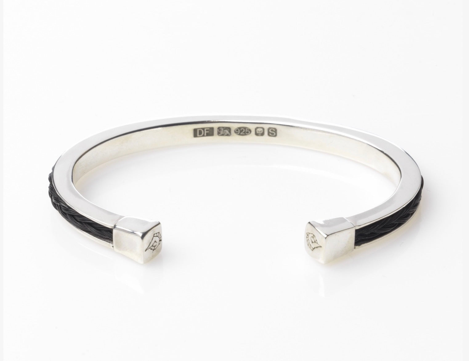 Forged Farriers Nail sterling silver torque bangle inlaid with black square-braided horse hair, showing the hallmark and engraved end caps.