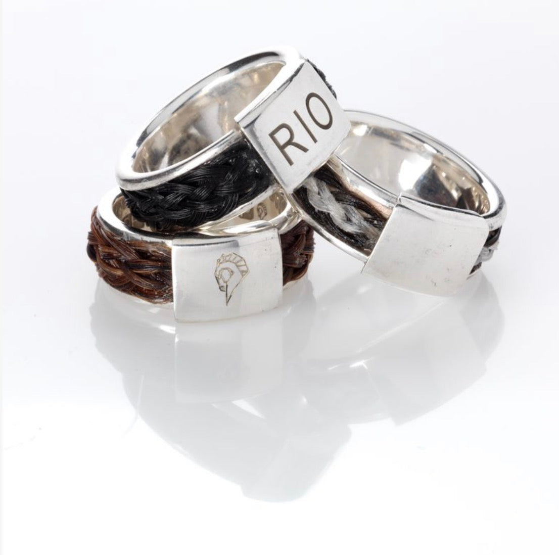 Three Quintessentially Equine Bold Braided Rings in sterling silver with black, chestnut and mixed-colour horse hair.