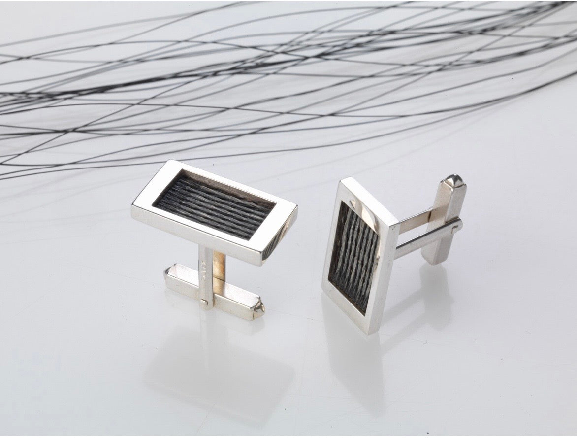 Woven Stories Ribbon Cufflinks in sterling silver with handwoven black horse hair in the Pin Stripe pattern.