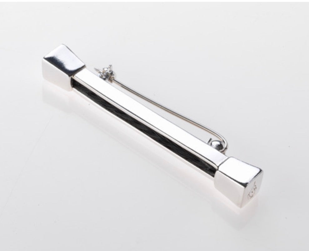 Top view of the Forged Farriers Nail sterling silver horse hair pin, showing its polished bar and pin fastening